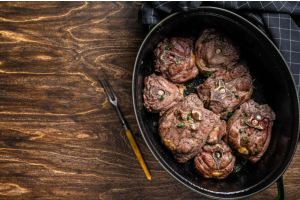 Slow-cooked halal lamb neck falling apart tenderly in a rich braise