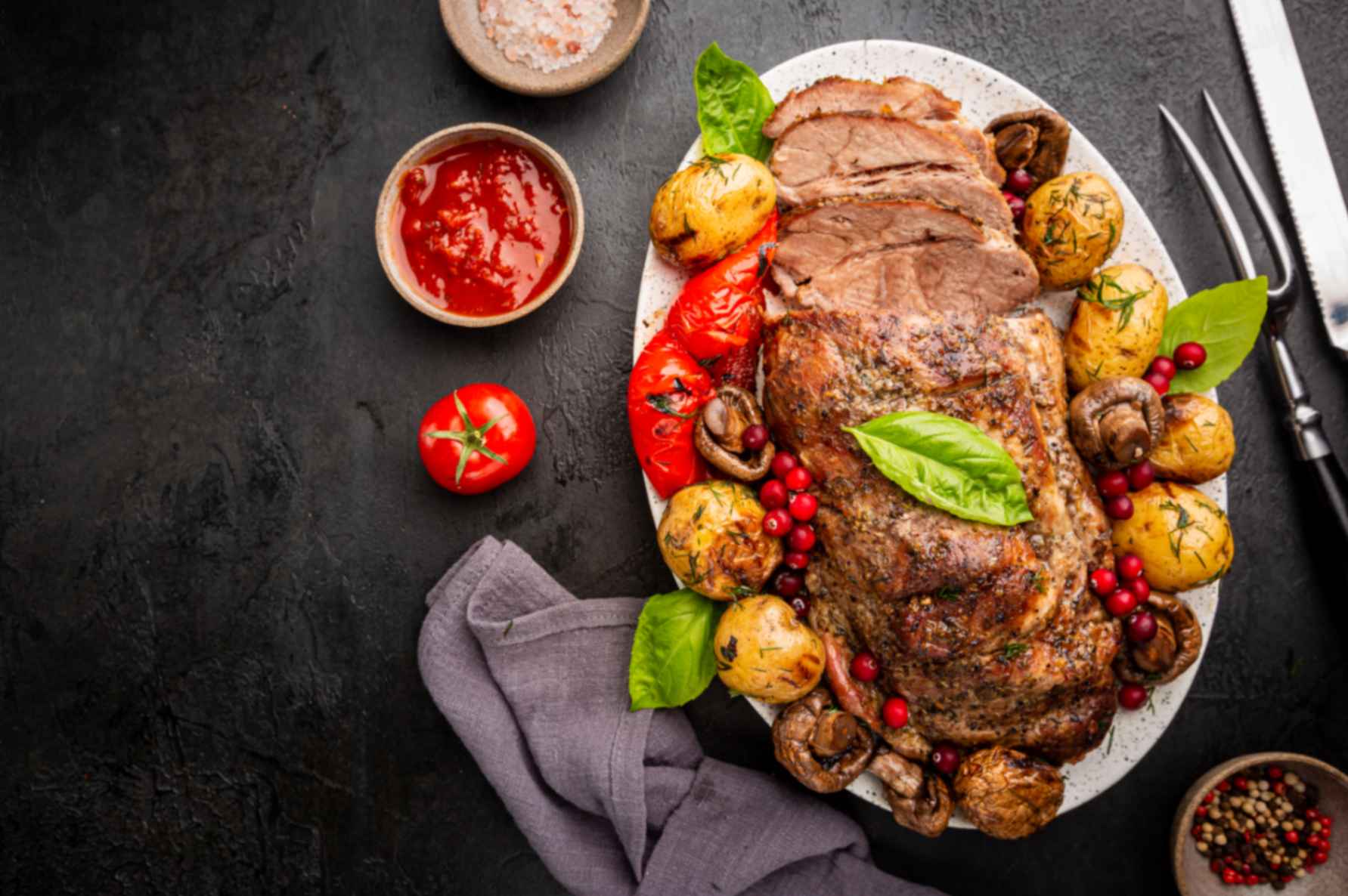 A slow-roasted halal lamb shoulder carved for Sunday with leftovers set aside for wraps and curry