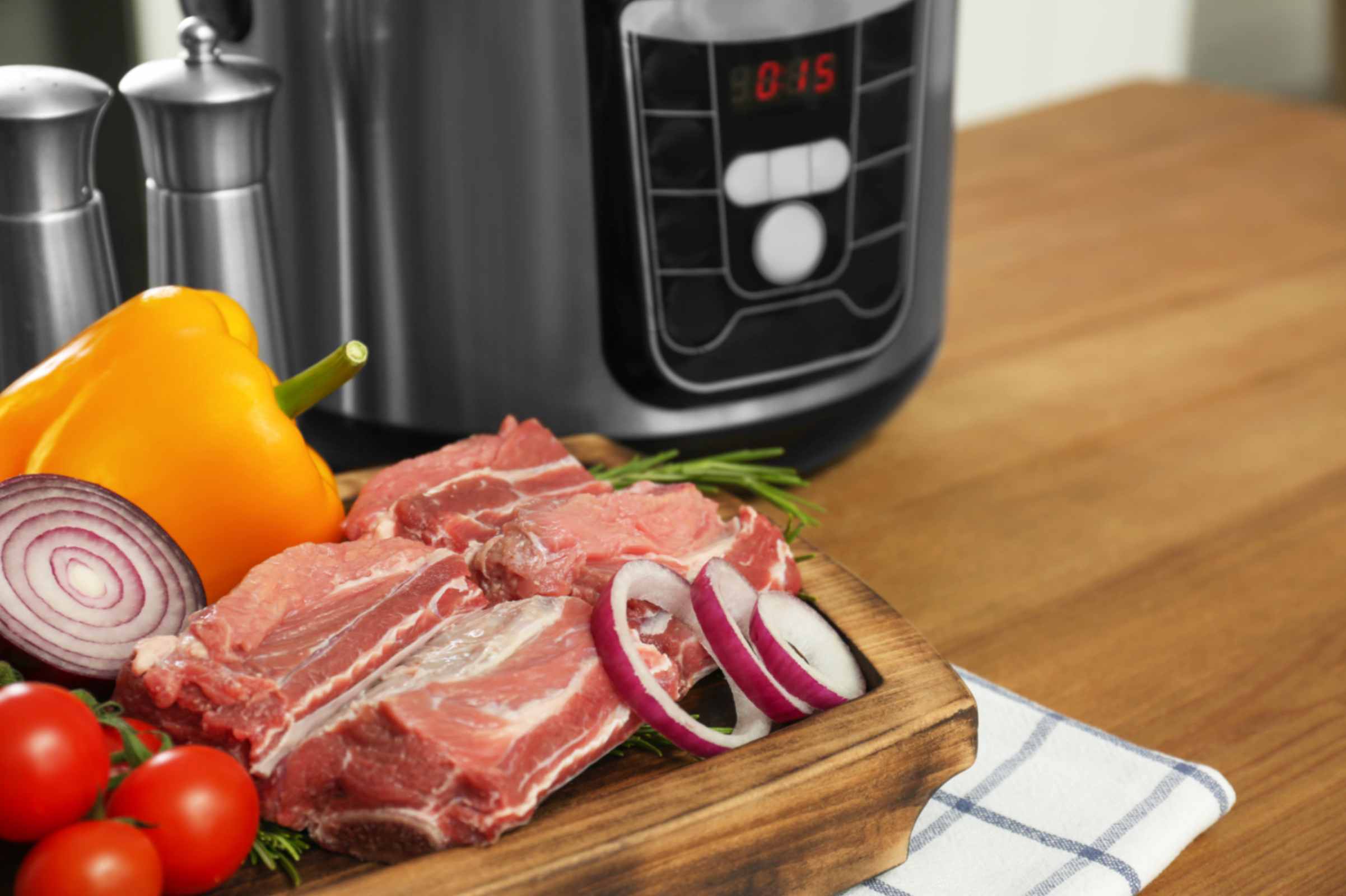 Halal beef shin and lamb shoulder cooking low and slow in a slow cooker