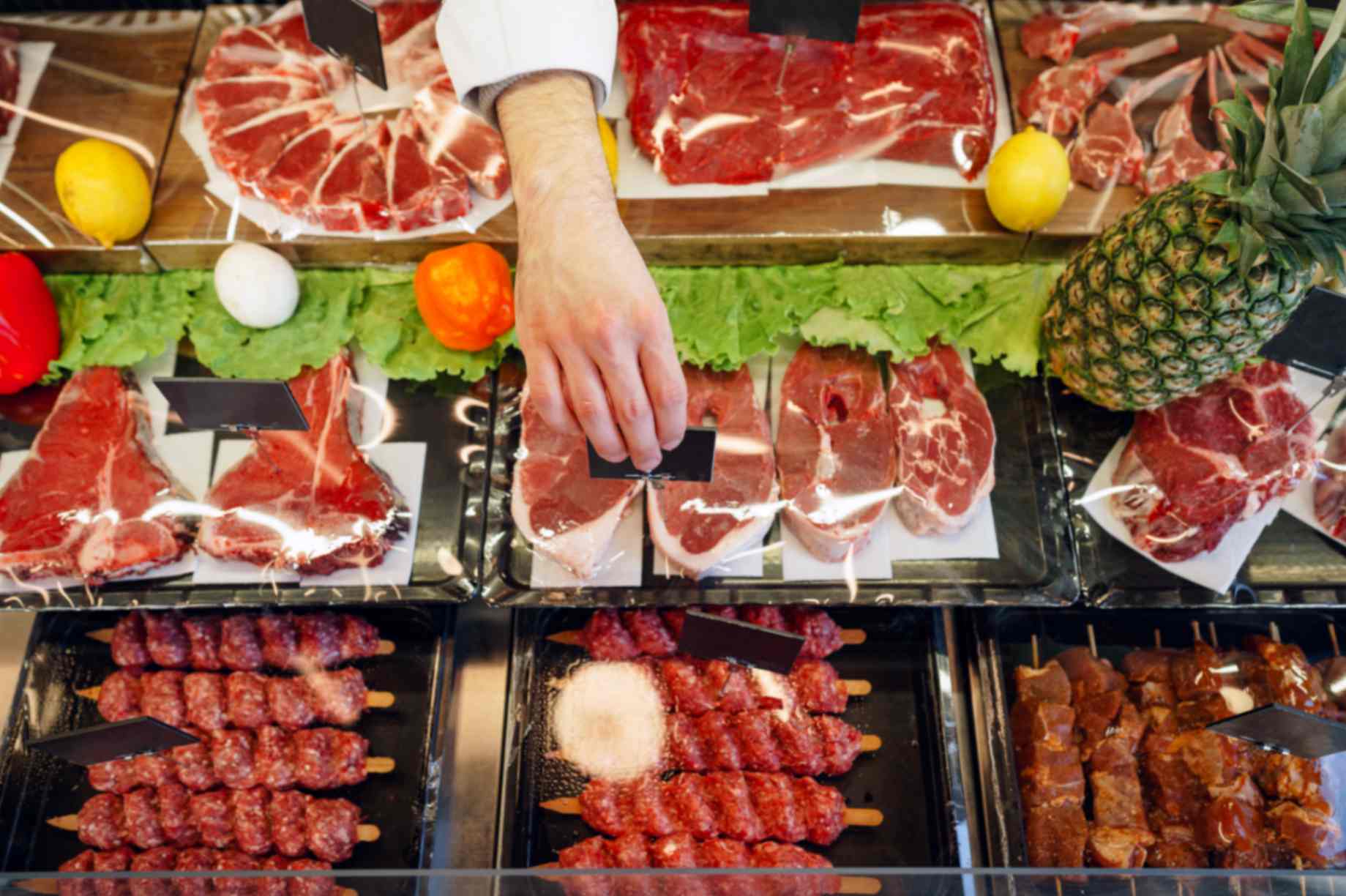 A Tariq Halal butcher counter with grill-ready halal BBQ meat boxes ready for collection