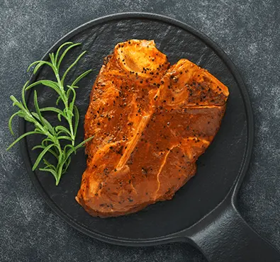 Halal marinated T-bone steak — fresh and seasoned from Tariq Halal UK